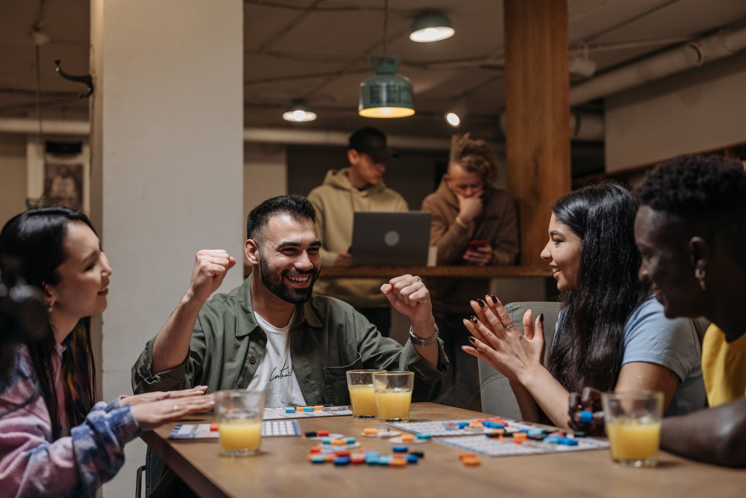 adults playing a board game