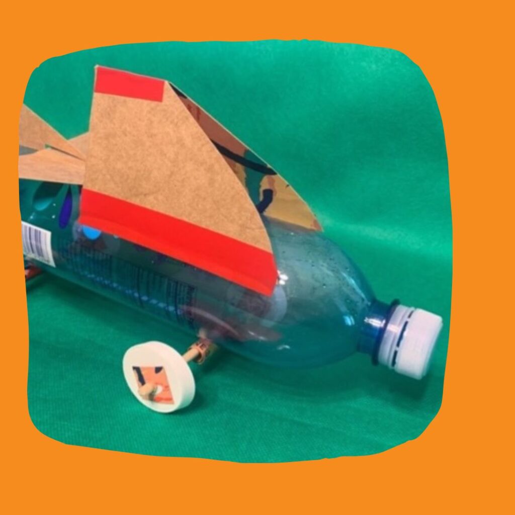 Toy made out of a water bottle and card board.