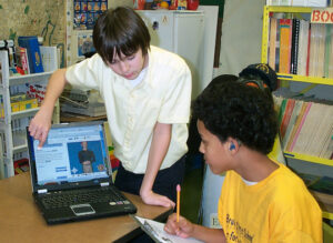 Students using the Signing Math and Science Dictionaries on a laptop.