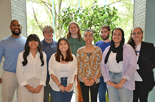 Seven TERC REU interns with the program's admin.