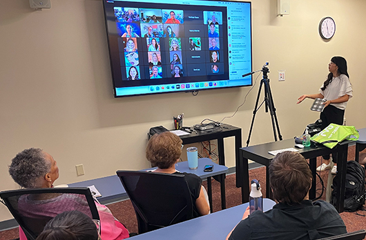 TERC Intern answering questions from a Zoom audience. 