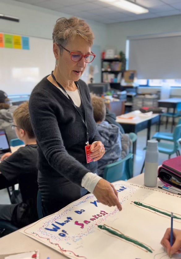 Jodi Asbell-Clarke in a classroom with students.